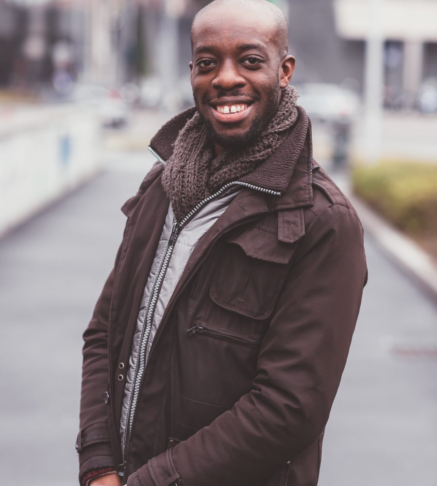 portrait of black man standing outdoor and looking camera